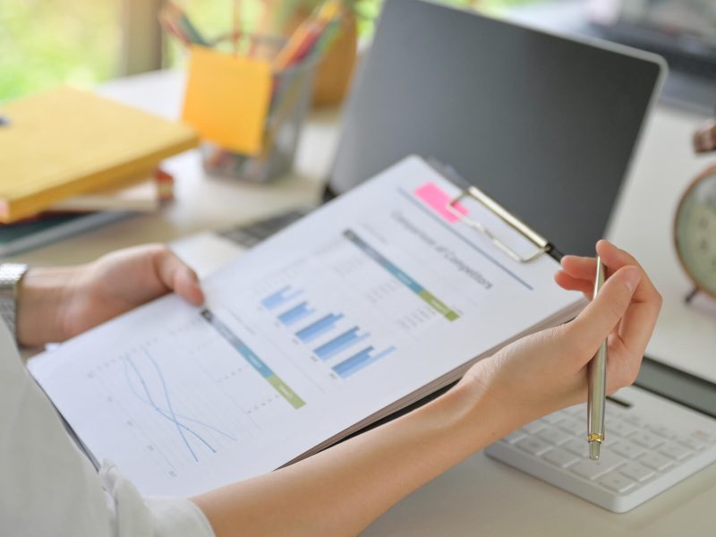 close-up-shot-of-executives-are-checking-the-compa-J6D8ZBJ